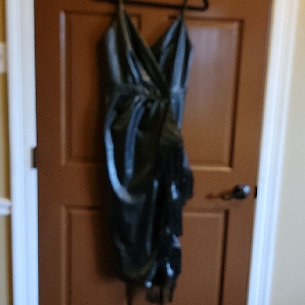 Fate-Faux leather black dress, sleeveless with draped fringe side Size Small.